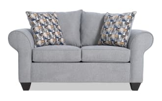 Kylie Gray 70'' transitional loveseat in gray polyester fabric with rolled arms, two patterned accent pillows, and plush memory foam seating.