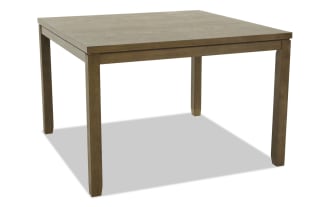 Rectangular wooden dining table with a warm brown finish, sturdy square legs, and a simple, classic design suitable for kitchen or dining room.