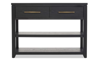Black wooden console table with two drawers featuring gold handles, and two open shelves for storage, modern minimalist design.