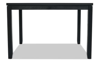 Black wooden dining table with a simple rectangular design, four sturdy legs, and a smooth flat top, suitable for modern interiors.