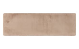 Rectangular beige faux fur rug with a soft, plush texture, ideal for adding warmth and comfort to home interiors.
