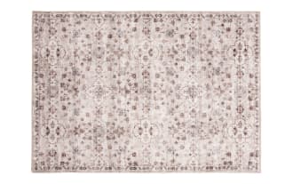 Vintage-style beige and brown patterned area rug with floral and geometric motifs, suitable for living room or bedroom decor.