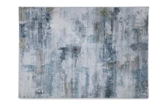 Abstract area rug with a distressed pattern in shades of blue, gray, and beige, featuring a soft, textured surface suitable for modern home decor.