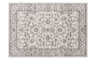 Vintage-style area rug with intricate floral and vine patterns in muted gray tones on a light beige background, featuring a detailed border design.