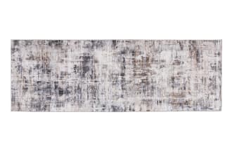 Runner rug with an abstract distressed pattern in shades of gray, beige, and white, featuring a low-pile texture suitable for hallways or entryways.