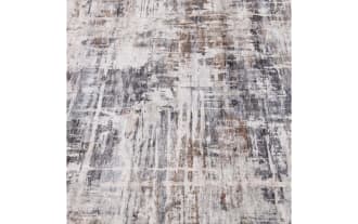 Area rug with an abstract distressed pattern in shades of gray, beige, and white, featuring a modern, textured design ideal for contemporary home decor.