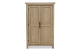 Wooden wardrobe with natural light oak finish, two paneled doors, and dark metal vertical handles, ideal for bedroom storage.