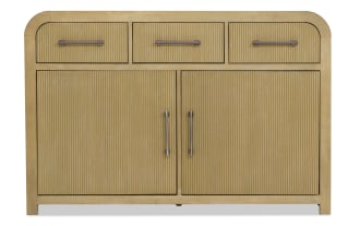 Light wood sideboard with ribbed texture, featuring three top drawers and two large cabinet doors with metal handles, modern design.