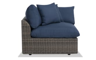 Dream Navy & Brown Wicker Outdoor Corner Chair from Dream Outdoor collection, featuring navy polyester cushions, all-weather wicker, and powder-coated aluminum frame.