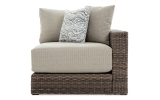 Modular Bob® Beige & Brown Wicker Outdoor Right Arm Facing Chair with beige polyester cushions, all-weather wicker, and rust-proof aluminum frame, transitional style.