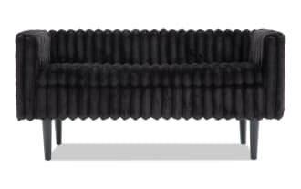 Modern black velvet sofa with ribbed texture, square arms, and tapered black legs, suitable for stylish living room seating.