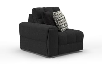 Modern black fabric sectional sofa corner piece with tufted cushions, wide armrest on left, and two decorative throw pillows.