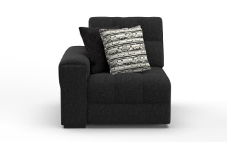Modern black fabric sectional sofa corner piece with tufted cushions, wide armrest on left, and two decorative throw pillows.