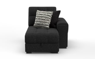 Modern black fabric chaise lounge with tufted seat and backrest, featuring two decorative cushions in black and patterned gray.