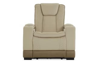 Beige and brown leather recliner chair with quilted side panels, cushioned armrests, and cup holders, designed for living room comfort.
