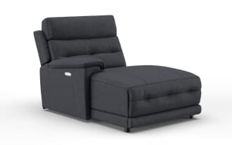 Modern dark gray upholstered chaise lounge with cushioned backrest, armrest, and stitched detailing, ideal for living room seating.