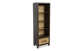 Tall wooden bookshelf with dark brown frame and light wood back panel, featuring three open shelves, one drawer with metal handle, and cable management hole.