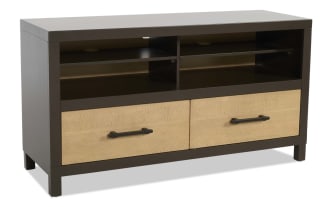 Modern TV stand with dark brown metal frame, light wood drawer fronts, two drawers with black handles, and open shelves for media devices.