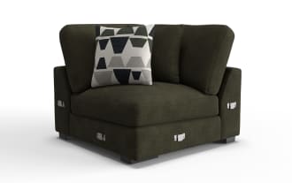 Dark olive green fabric corner sofa section with textured upholstery, loose back cushions, a geometric patterned throw pillow, and metal corner connectors.