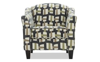 Contemporary club chair with geometric patterned upholstery in black, beige, and olive green, featuring curved arms and dark wooden legs.