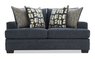 Dark blue upholstered loveseat with plush cushions, featuring patterned throw pillows in geometric and textured designs, ideal for modern living rooms.