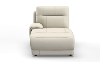 Modern beige leather chaise lounge with detailed stitching, cushioned armrest, and low black legs, designed for stylish comfort.
