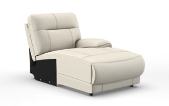 Modern beige leather armless lounge chair with cushioned backrest, single armrest on right side, and visible stitching details.
