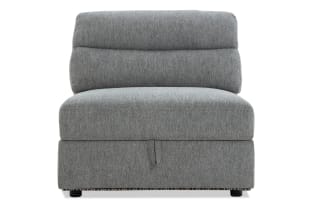 Gray fabric armless accent chair with cushioned back and seat, modern minimalist design, suitable for living room or lounge seating.