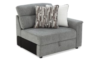 Adjustable black metal bed frame with gray fabric upholstery, featuring a segmented design for customizable comfort and support.