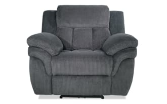 Gray plush fabric recliner chair with padded armrests and cushioned backrest, designed for living room comfort and relaxation.