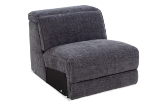 Modern armless accent chair upholstered in dark gray textured fabric with a thick cushioned seat and backrest, ideal for contemporary living spaces.