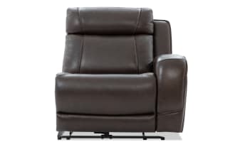 Dark brown leather recliner chair with padded armrest and cushioned backrest, featuring visible stitching and metal reclining mechanism.