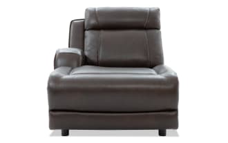 Dark brown leather recliner chair with padded armrest and cushioned backrest, designed for comfort and modern living room seating.