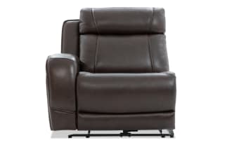 Dark brown leather recliner chair with padded armrest, cushioned backrest, and visible stitching, designed for comfort and relaxation.