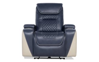 Blue and beige leather recliner chair with quilted stitching, padded armrests, and built-in cup holders, designed for home theater comfort.