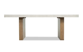 Rectangular dining table with a light gray concrete top and sturdy brown wooden legs, modern minimalist design.