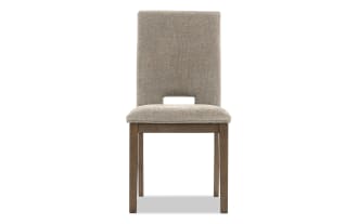 Upholstered dining chair with beige fabric seat and backrest, wooden legs, modern design, suitable for home or office seating.