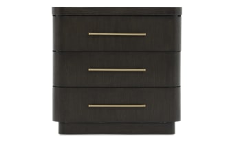 Dark wood three-drawer nightstand with rounded edges and sleek gold metal handles, suitable for modern bedroom storage.