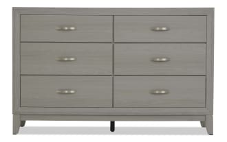Six-drawer light gray wood dresser with brushed metal handles, modern style, rectangular frame, and sturdy legs for bedroom storage.