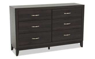 Dark wood six-drawer dresser with brushed metal handles, modern design, rectangular frame, and tapered legs for bedroom storage.