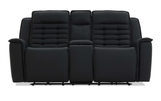 Black leather reclining loveseat with padded armrests, segmented cushioned backrests, and a center console, ideal for home theater seating.