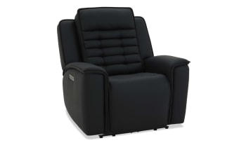 Black leather recliner chair with padded armrests and cushioned backrest featuring horizontal stitching, designed for comfort and relaxation.