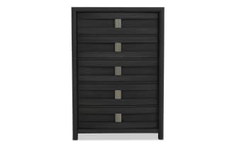 Black wooden chest of drawers with five horizontal drawers, modern metal handles, and a sleek, textured finish, ideal for bedroom storage.