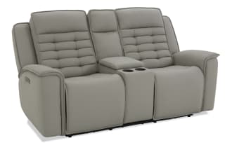 Gray leather reclining loveseat with padded armrests, tufted back cushions, and center console with cup holders, modern style.