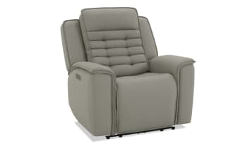 Modern gray leather recliner chair with padded armrests, cushioned backrest, and stitched detailing, designed for comfort and relaxation.