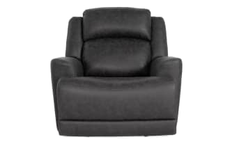 Dark gray leather recliner chair with padded armrests and cushioned backrest, designed for comfort and modern living room decor.