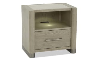 Light wood nightstand with a single drawer, metal handle, open storage space, and metal legs, suitable for bedroom furniture.