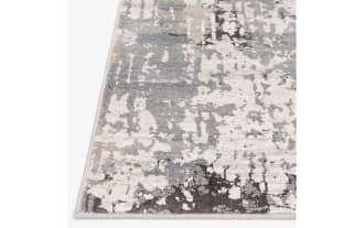Contemporary area rug with an abstract distressed pattern in shades of gray, beige, and cream, featuring a soft, textured surface suitable for modern living spaces.