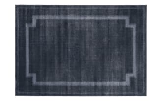 Dark blue rectangular area rug with a subtle geometric border pattern, featuring a soft, velvety texture ideal for modern home decor.