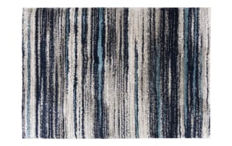 Rectangular area rug with a striped pattern in shades of blue, gray, black, and white, featuring a textured, plush material suitable for modern home decor.